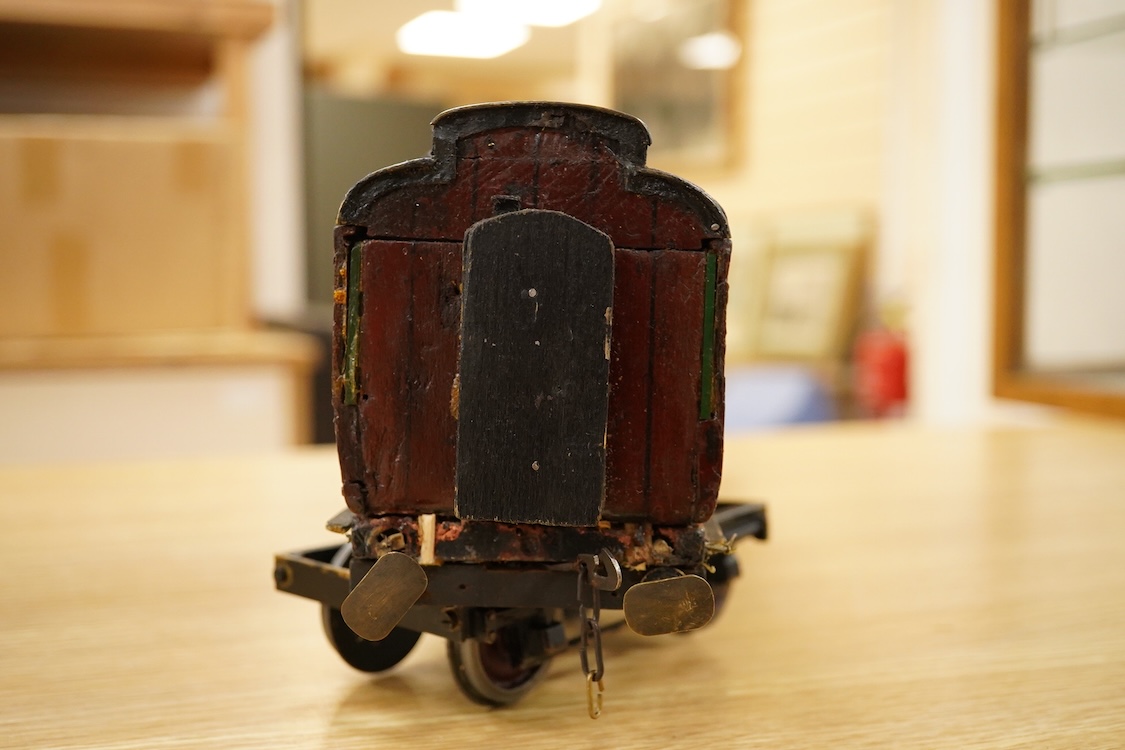 Two Gauge One bogie coaches; a Midland Railway clerestory coach, together with a 12-wheel Pullman car (bogies af), plus an American outline caboose, some scratch building and adaptation from kits, etc.